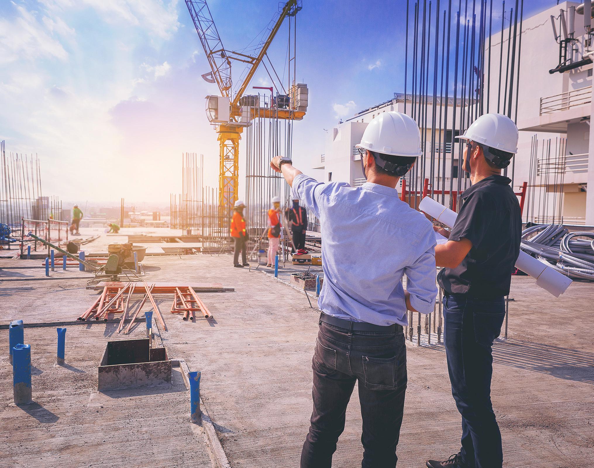 Engineers reviewing a high-rise construction site in Bengaluru